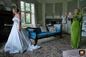 The bride and her sister stay absorbed in bridal prep at Tissington Hall in Derbyshire.